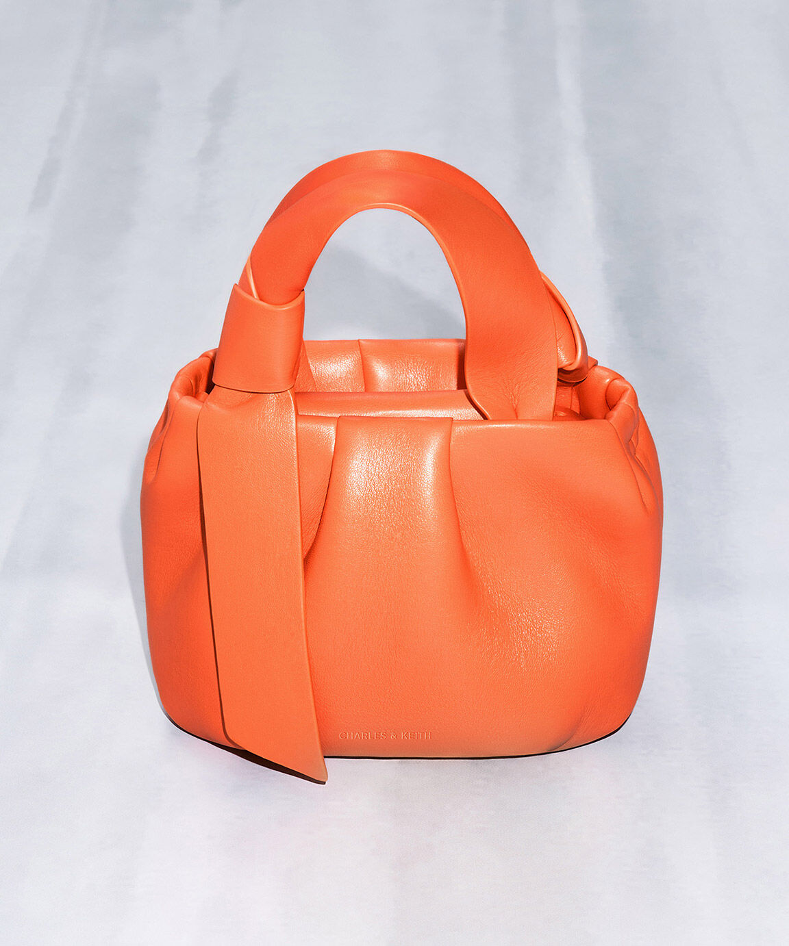 Charles and keith orange bag deals