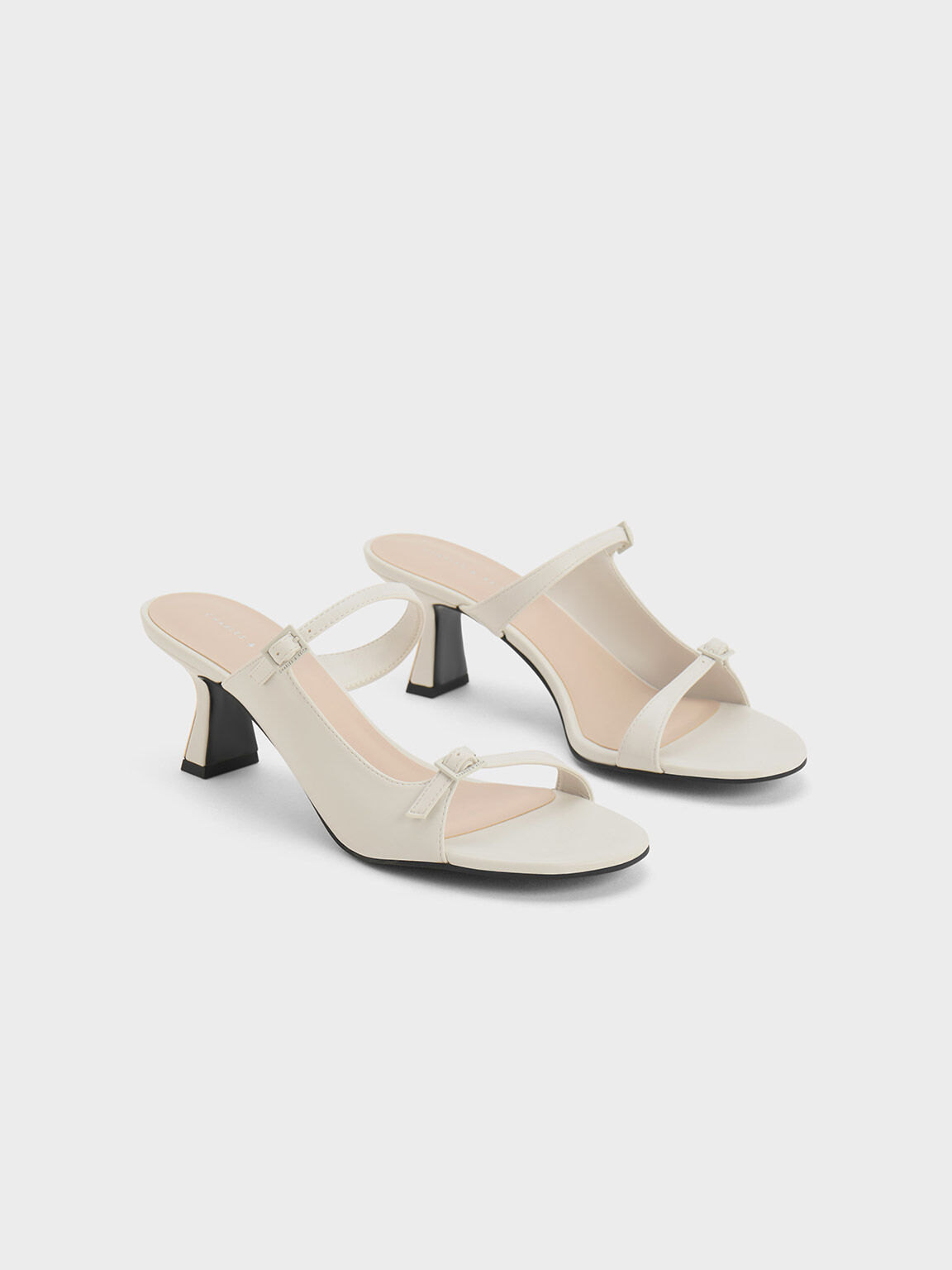 Heeled mules shop with asymmetrical straps