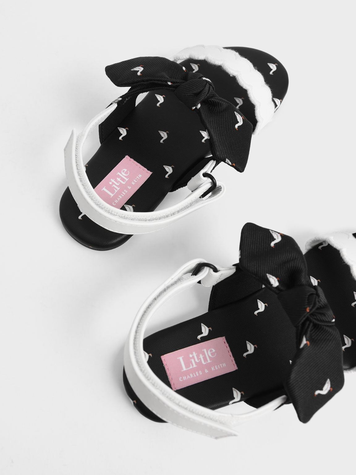 Girls' Printed Bow-Tie Flat Sandals, Black, hi-res