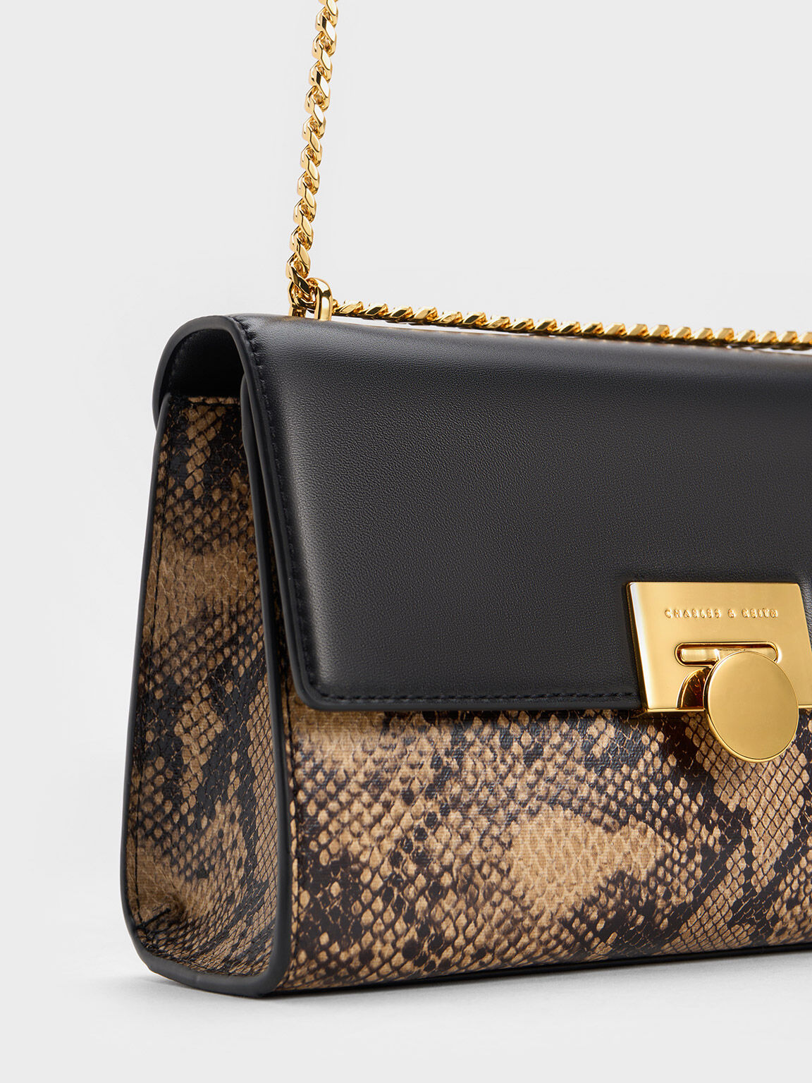 Beige snake print best sale clutch bag