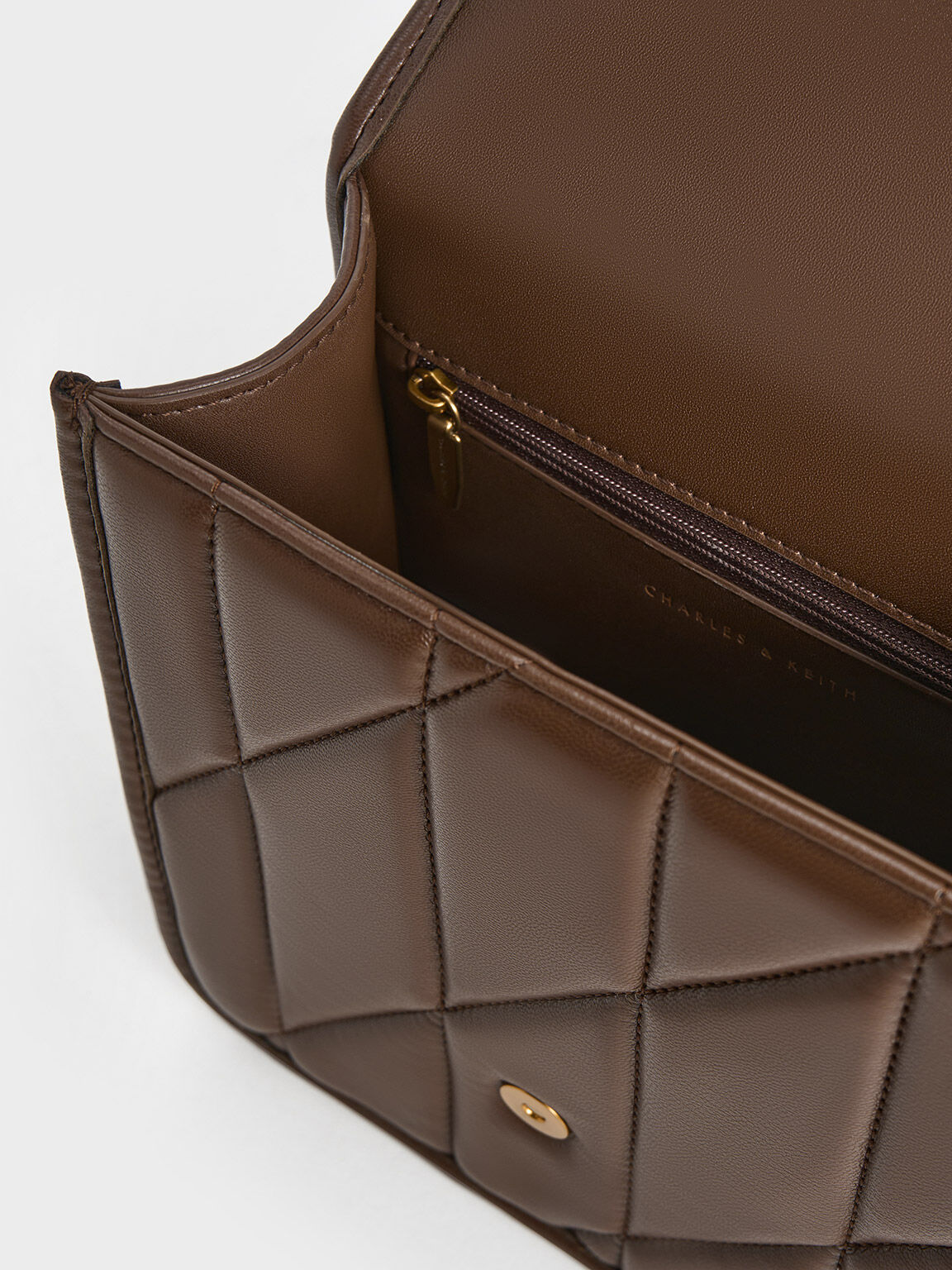 Dark Brown Lin Quilted Belted Backpack CHARLES KEITH UK