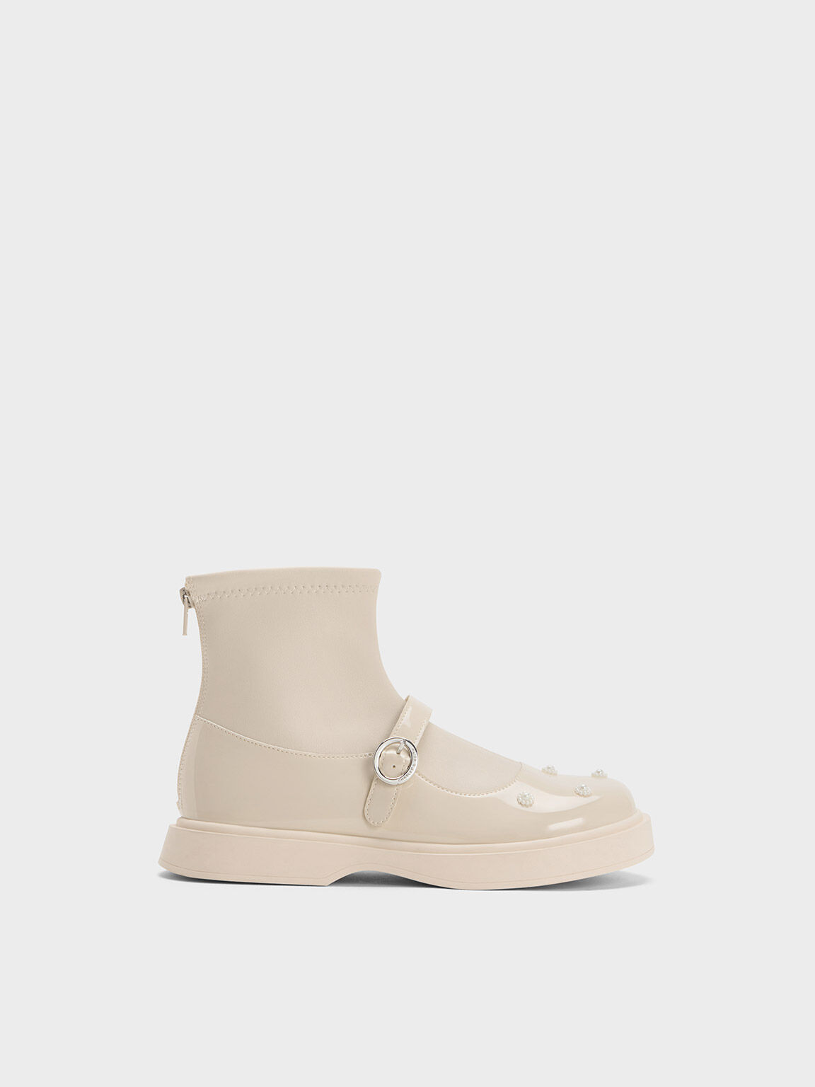Cream patent online ankle boots