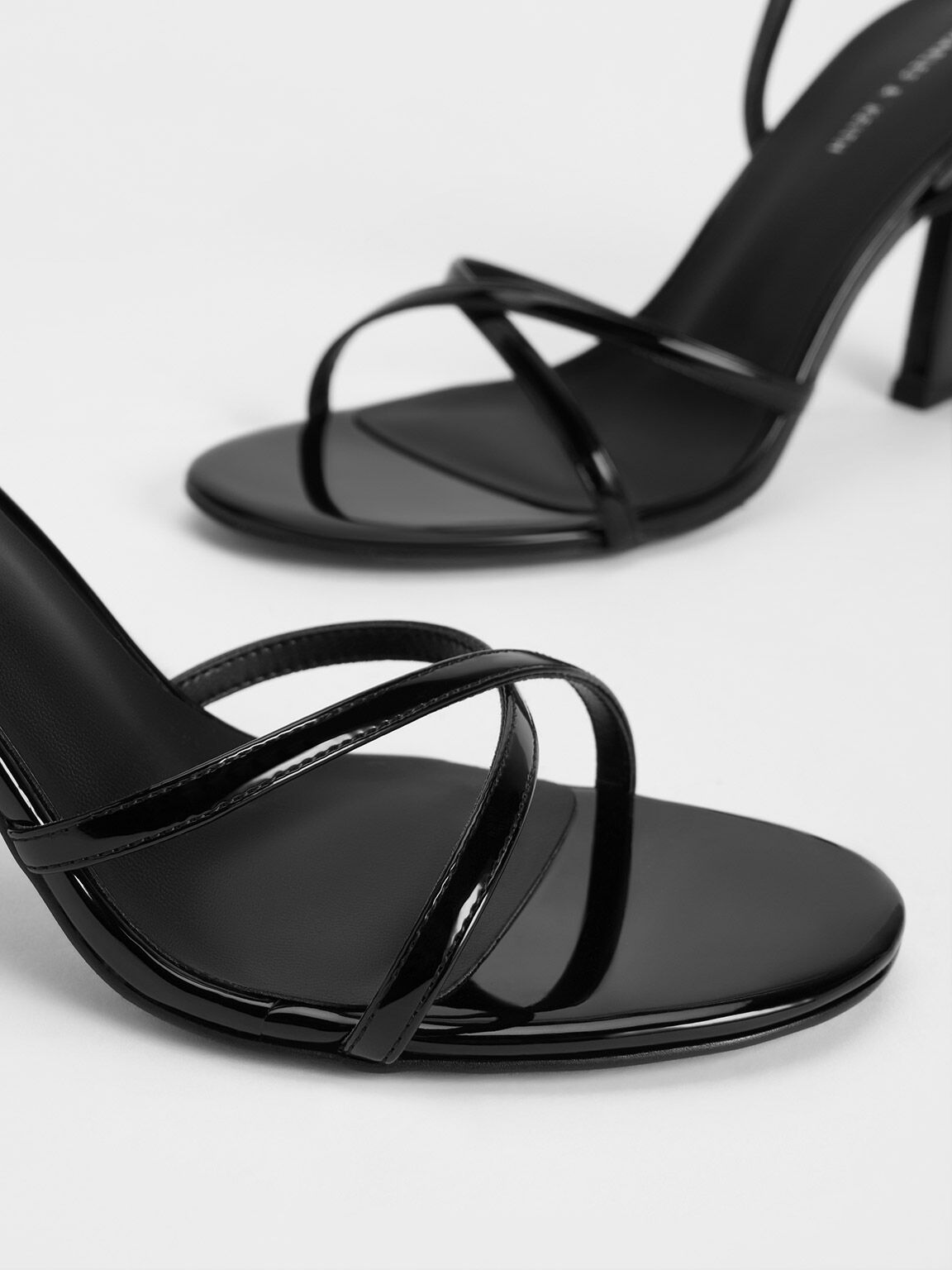 Shiny black strappy store heels