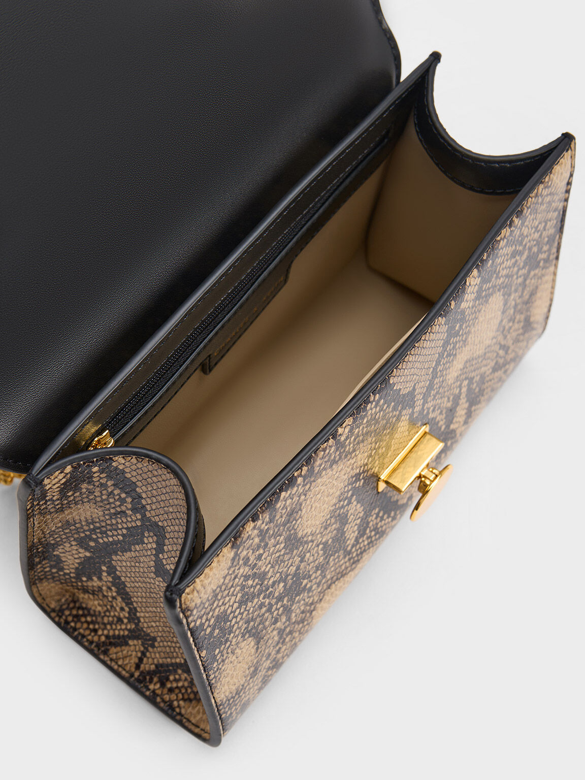 Beige snake discount print clutch bag