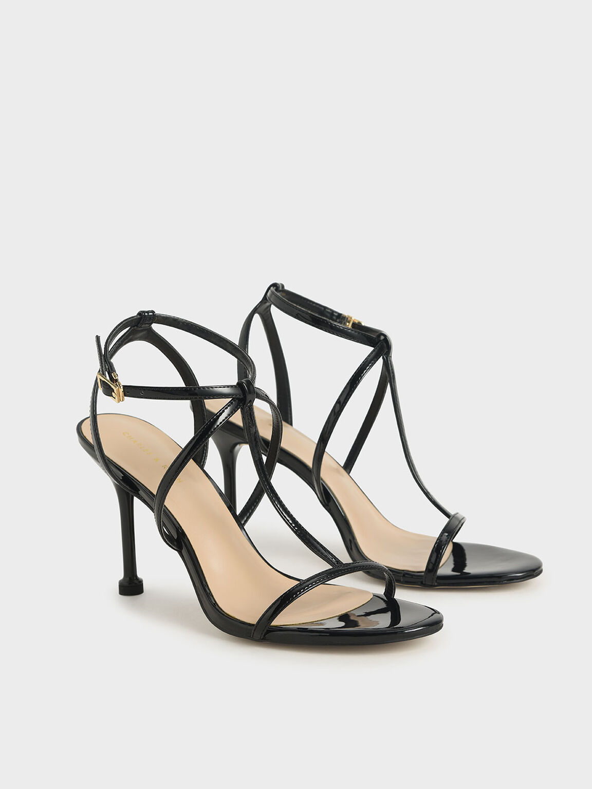 black patent strappy pointed toe heels