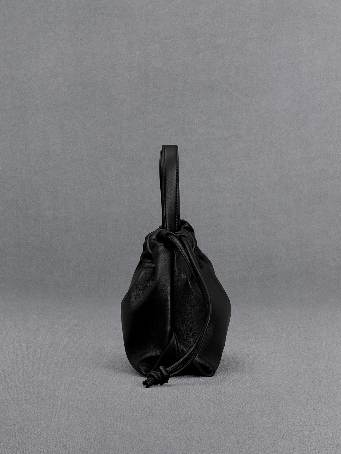 Black leather drawstring bag top