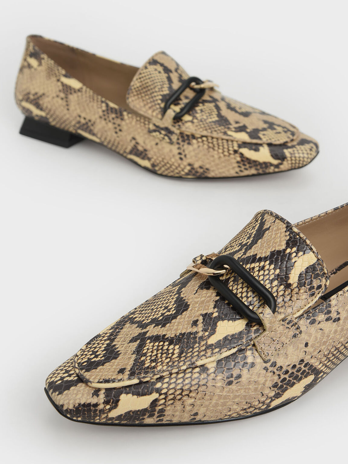 snake print backless loafers