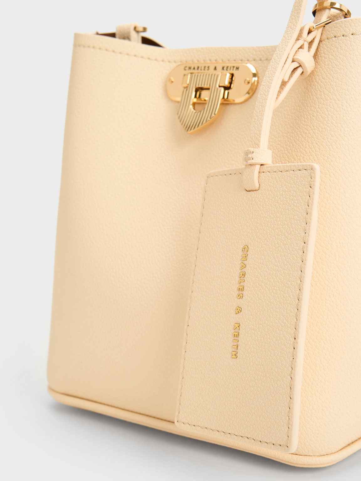 Beige bucket bag store