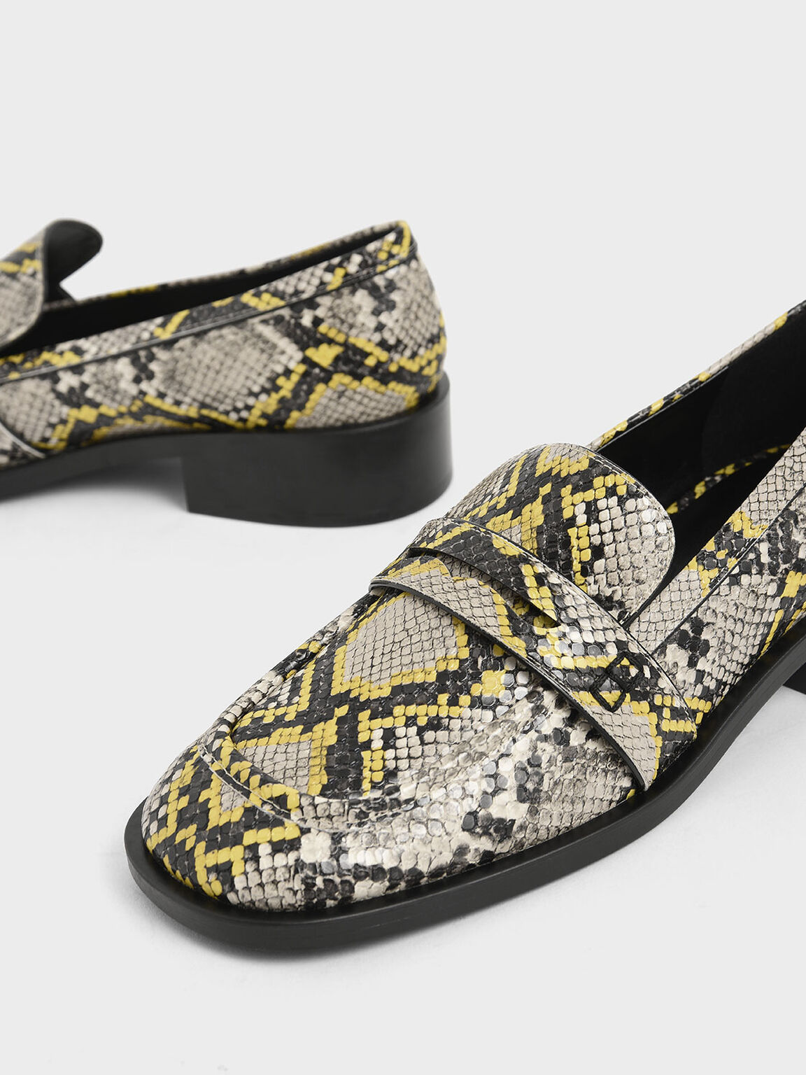 snake print backless loafers
