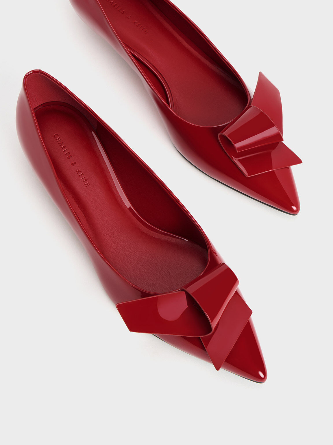 Red pointed flat shop shoes