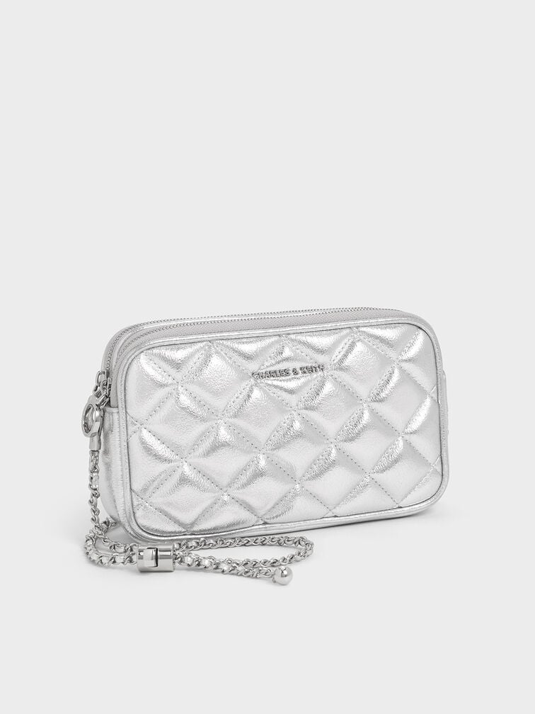  Metallic silver mini quilted crossbody bag, the perfect plus-one for a cocktail wedding. 