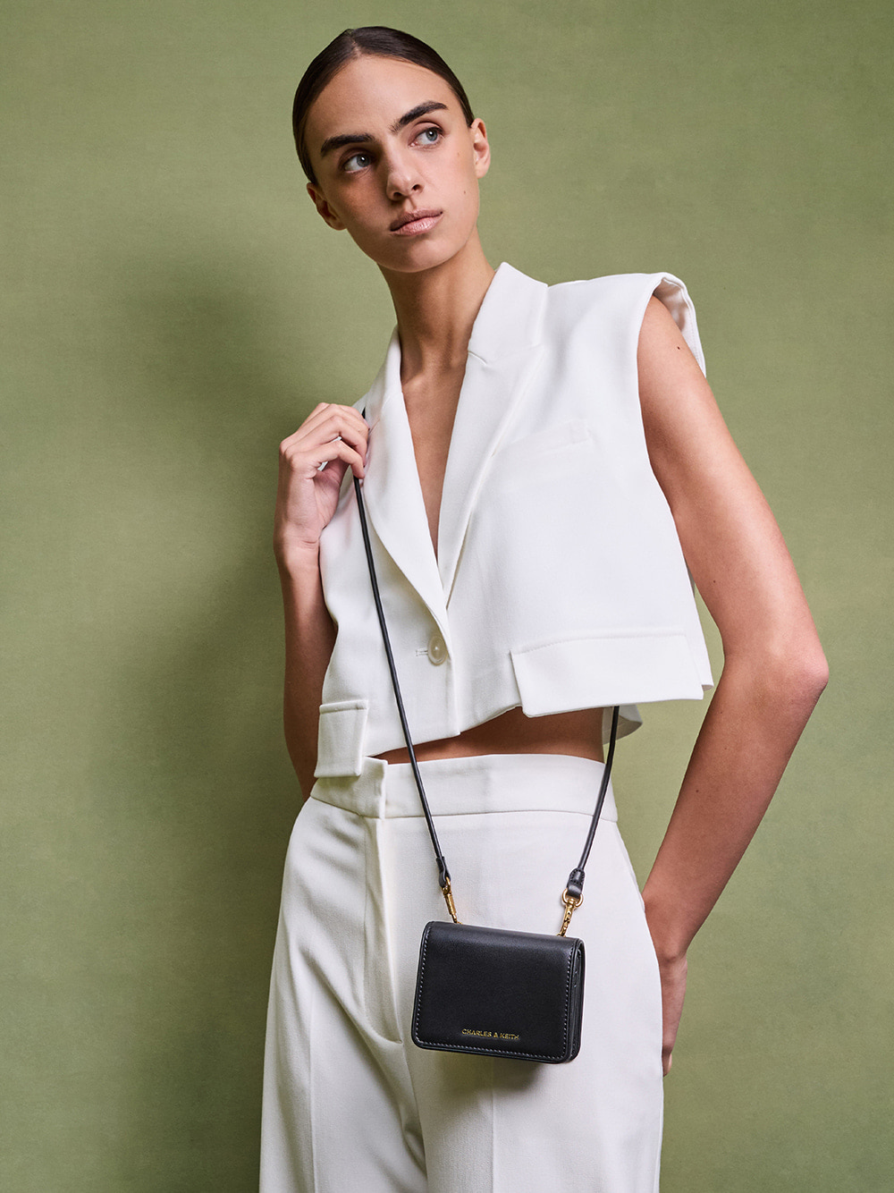 Women’s Lyla knotted-strap wallet in black - CHARLES & KEITH