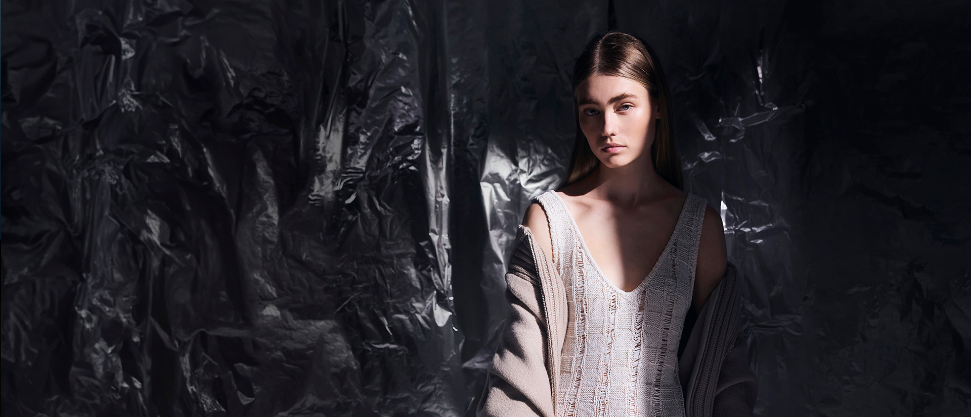 Banner for gloomy girl aesthetic featuring model in a zip-up outerwear and black gloves - CHARLES & KEITH