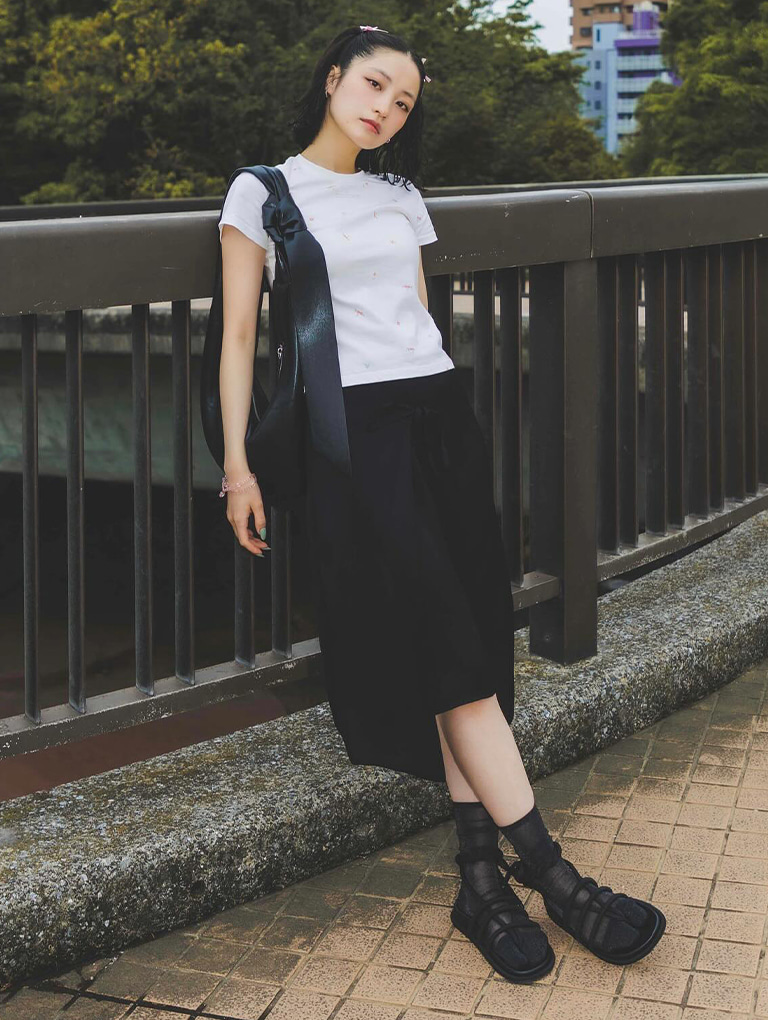 Women’s Toni Knotted Curved Hobo Bag in noir and Toni Tubular Tie-Around Sandals in black, as seen on Lisa – CHARLES & KEITH