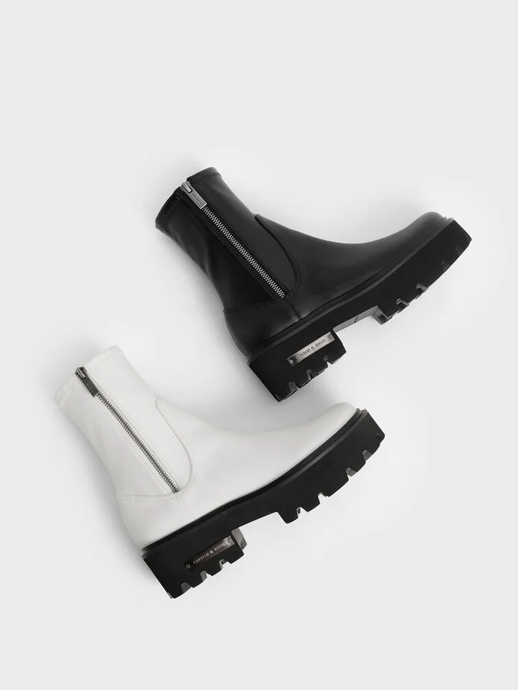 Classic ankle boots with flat but chunky ridged soles.