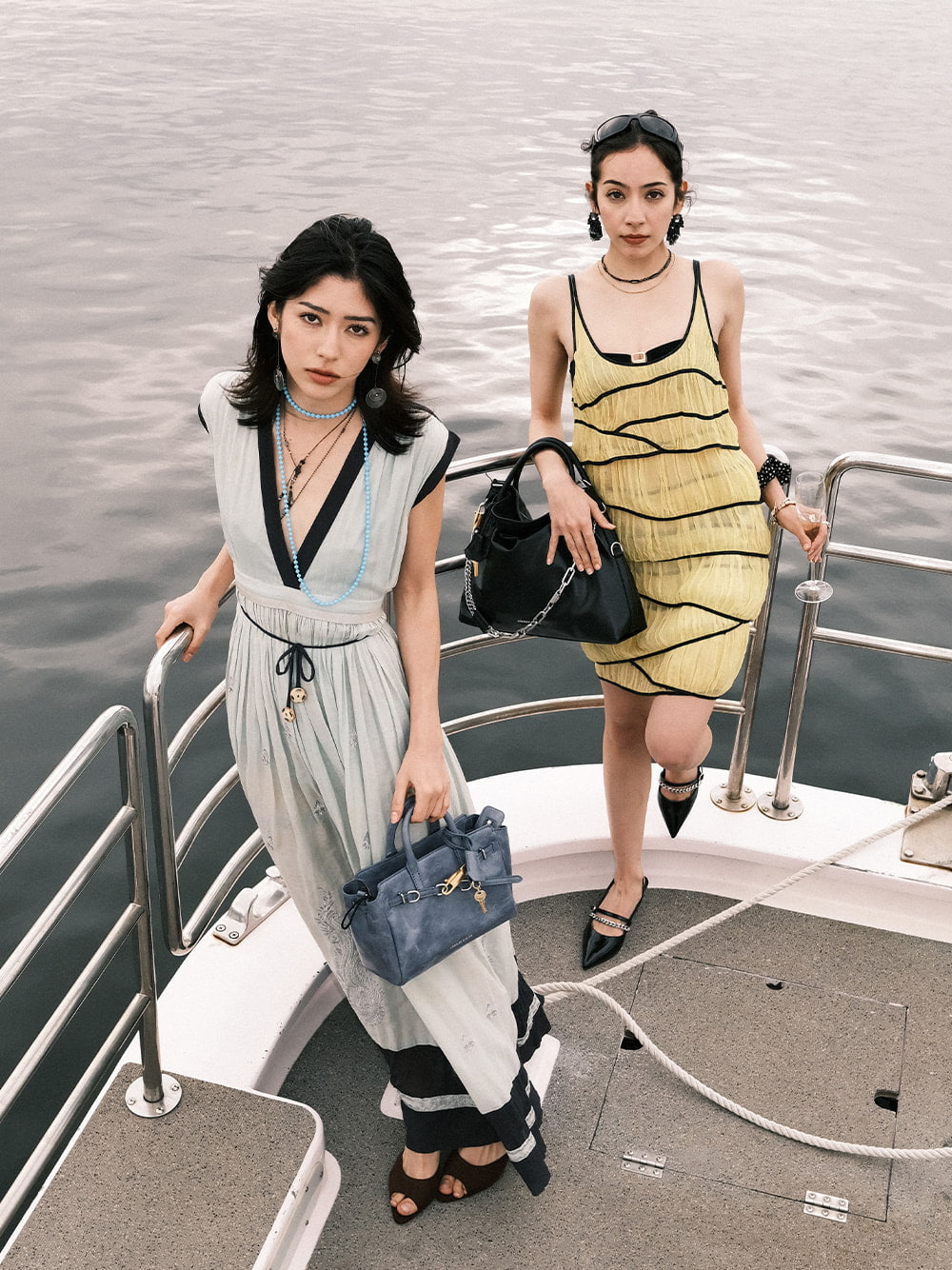 Women’s distressed Delfina belted tote bag and Delfina chain tote bag, as seen on Ninon & Momoe - CHARLES & KEITH
