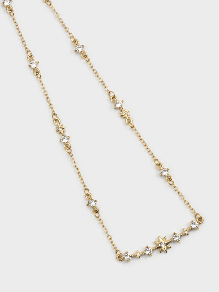 Gold-toned jewellery adds just the right amount of shine to your winter white outfit.