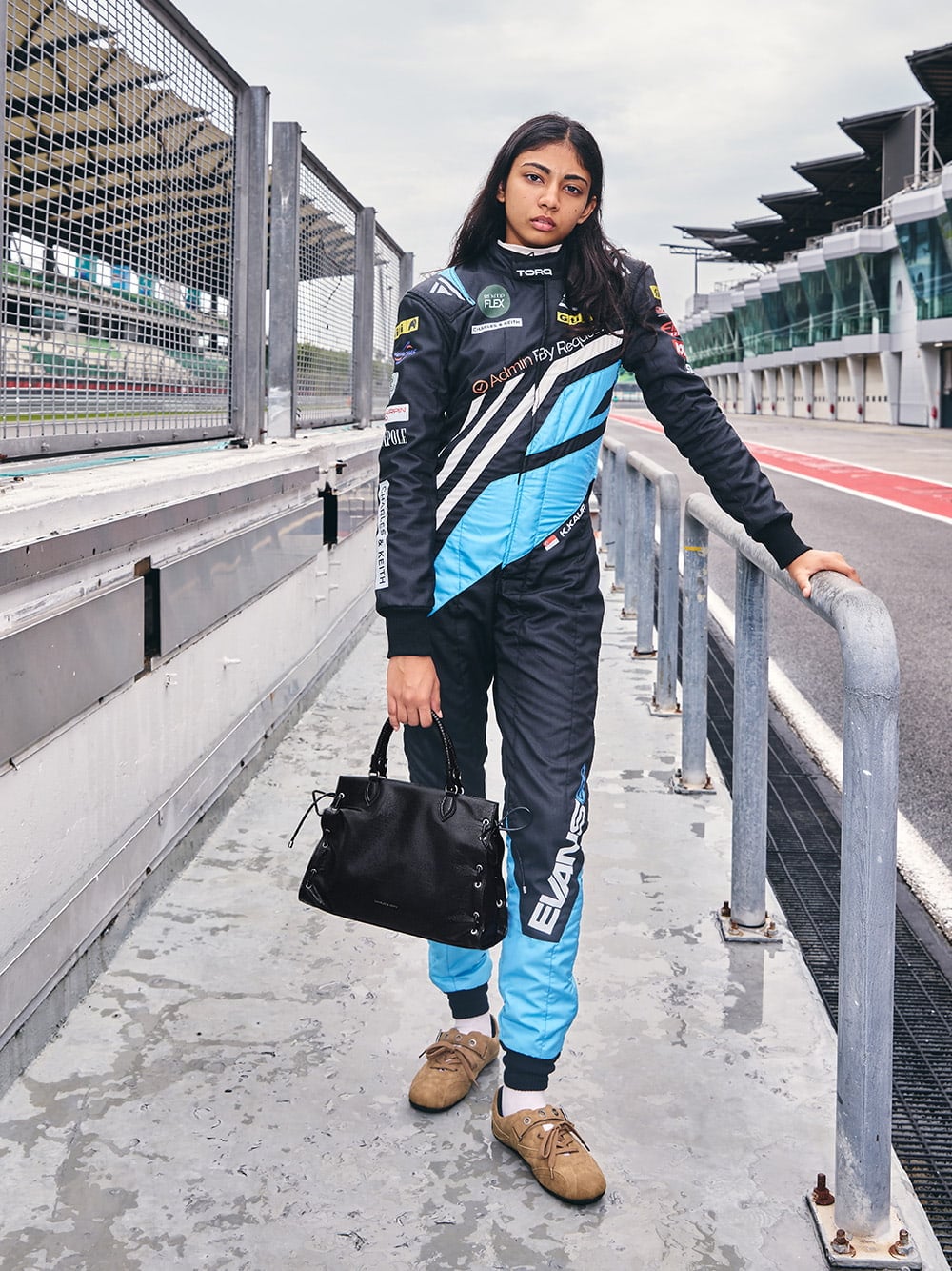Kareen Kaur with Large Nylah Grommet Lace-Up Tote bag and Jollie Grommet Mary Jane sneakers - CHARLES & KEITH