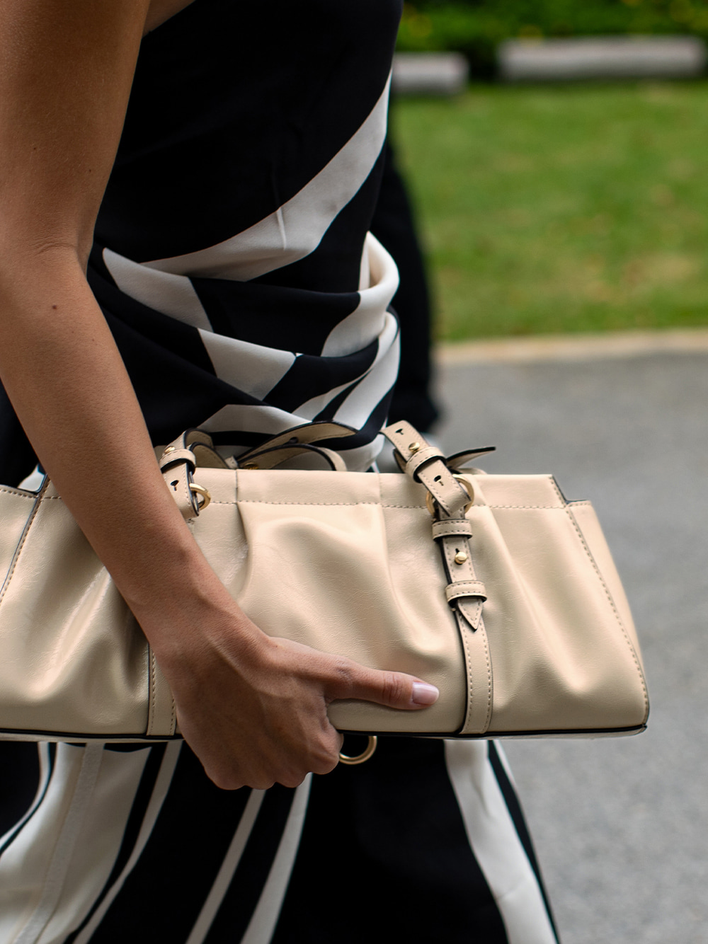 Women’s Britton ruched elongated shoulder bag & Pauline patent crossover slingback kitten heels, as seen on Carmen Montero Mundt – CHARLES & KEITH