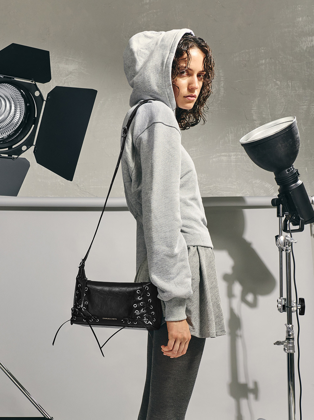 Women’s Xylia metallic grommet lace-up shoulder bag - CHARLES & KEITH