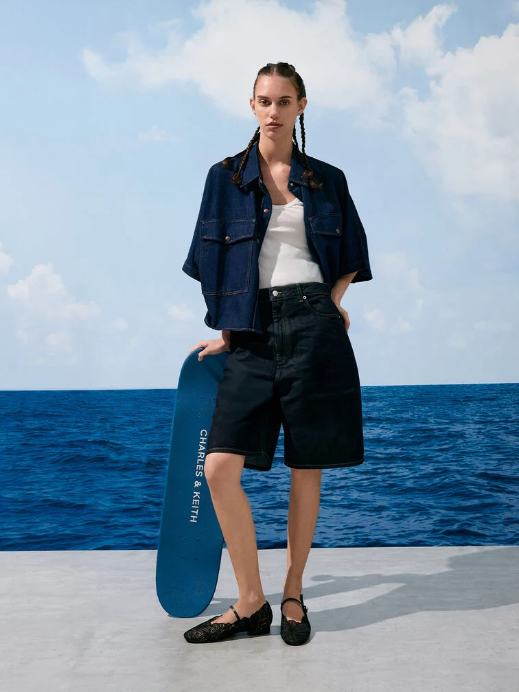 Black floral-crochet Mary Janes will add feminine charm to a polished tonal denim-on-denim combination 