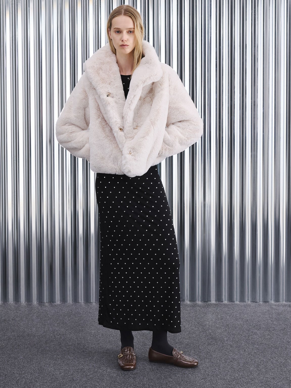 A long maxi dress paired with cropped outerwear 