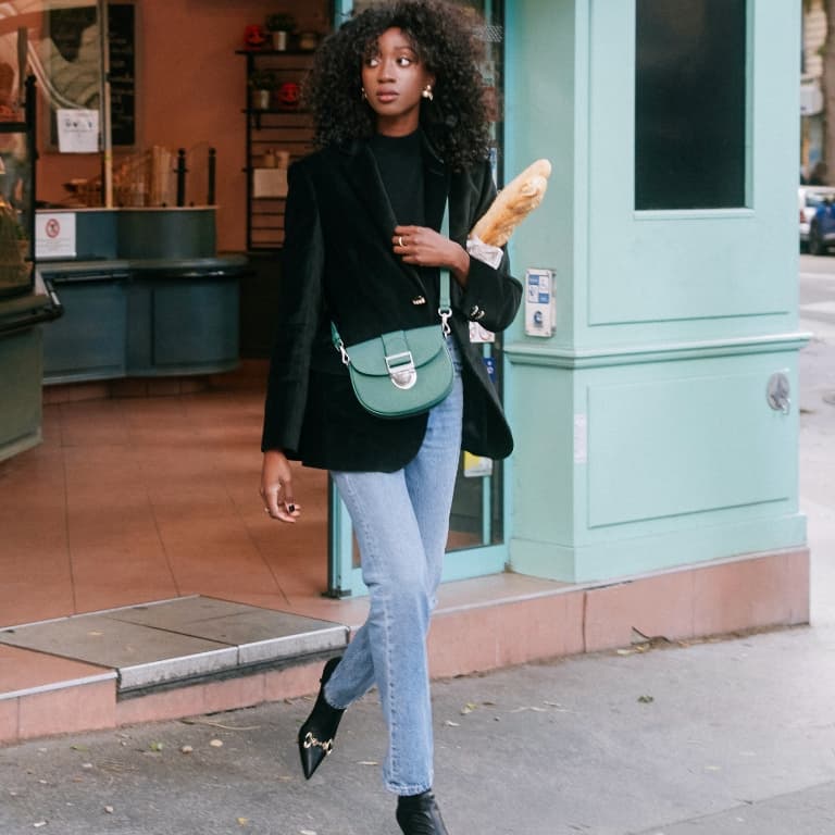 Women’s Amelia metallic push-lock crossbody bag and Elery slip-on ankle boots, as seen on Emmanuelle Koffi - CHARLES & KEITH