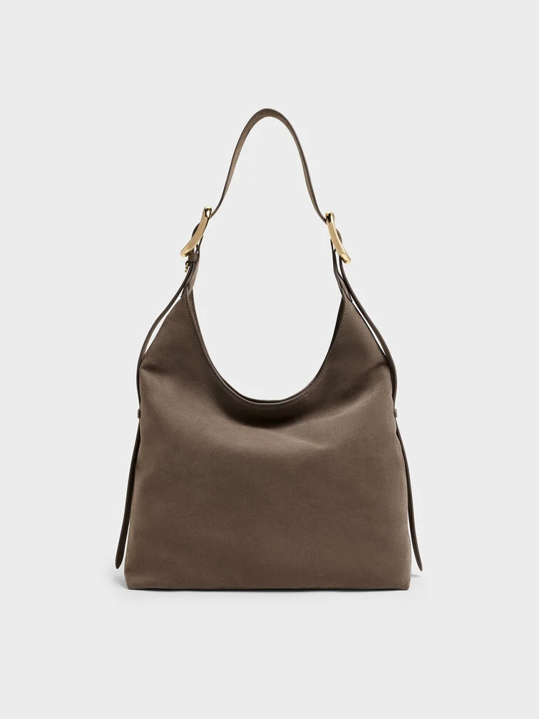 The Aislin hobo bag in stone grey features a spacious silhouette suitable for carrying everyday essentials.