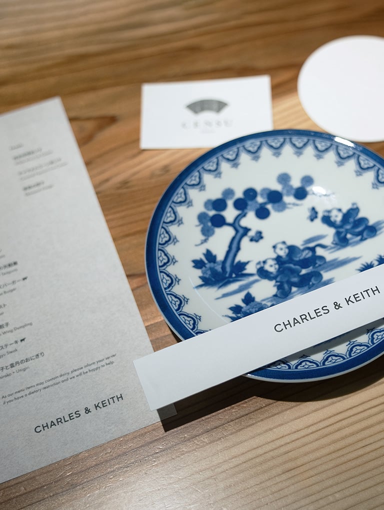 CHARLES & KEITH branded menu and chopstick sleeve at CENSU TOKYO