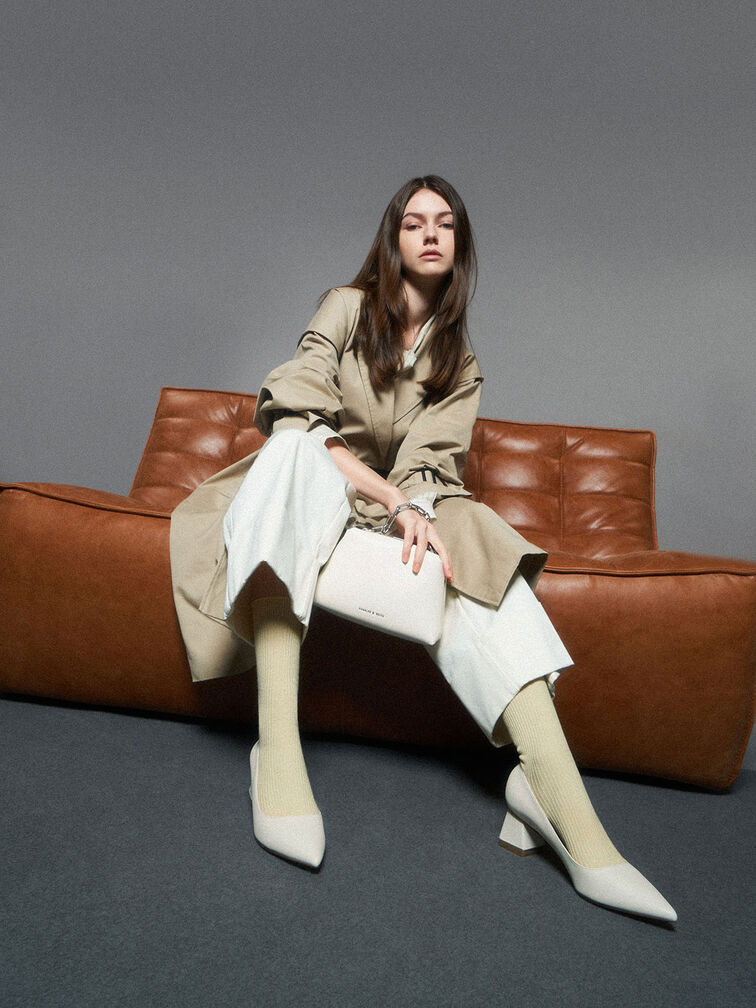 A winter white outfit comprising of varying shades of white like chalk, cream and light-beige neutrals.