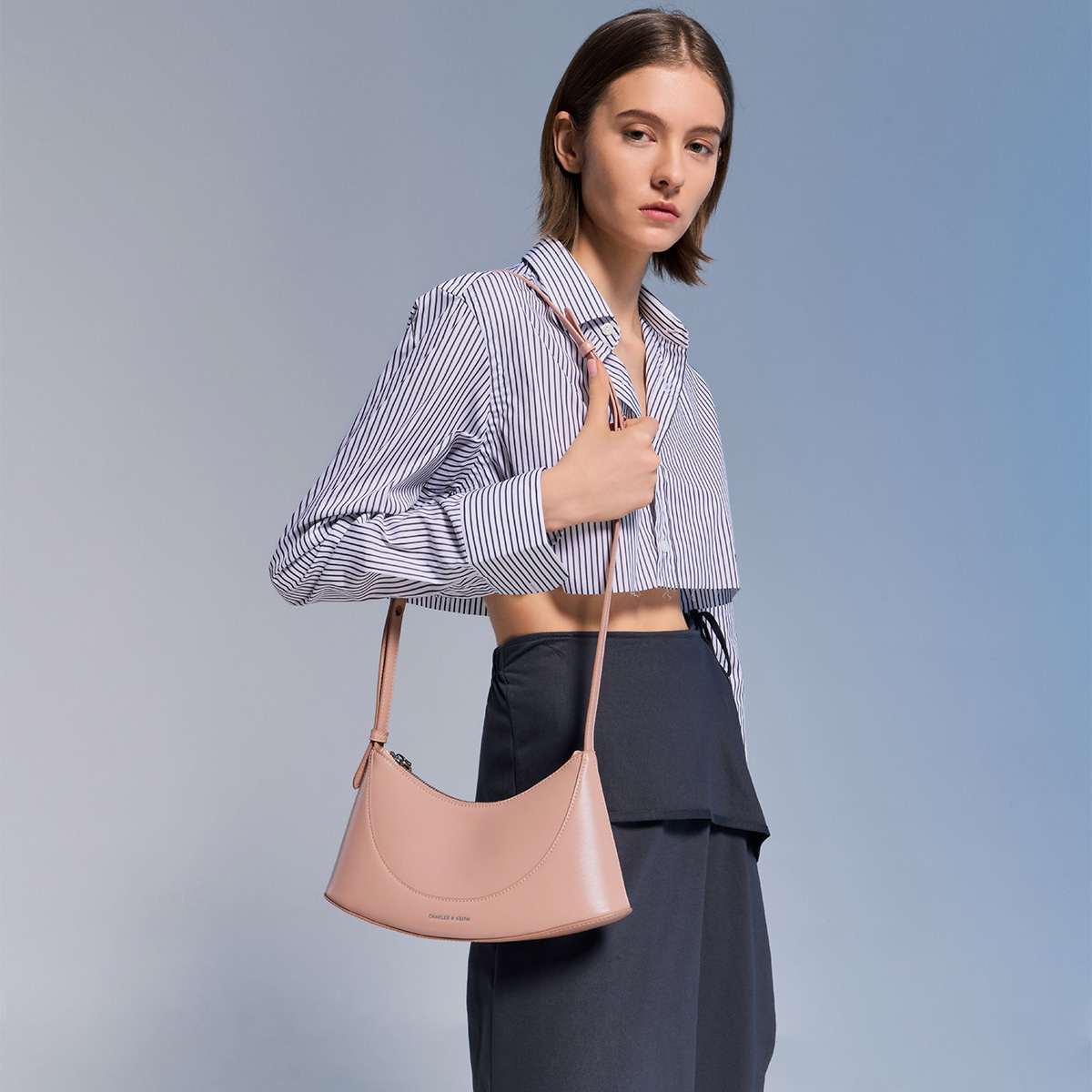 Women’s Metallic Pointed-Toe Slingback Kitten Heels in silver; Sigrid Shoulder Bag in light pink – CHARLES & KEITH