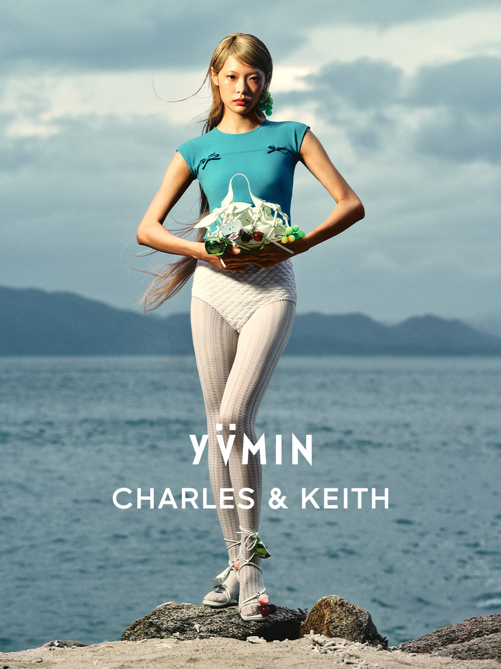 Women’s Ally ruched slouchy knotted bag in mint sorbet with green apple charm, strawberry charm, grape charm, cherry bear charm and metallic apple charm — YVMIN x CHARLES & KEITH