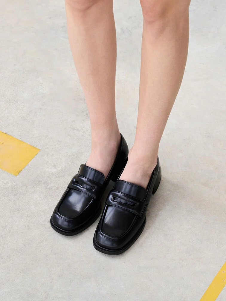 Black penny loafer pumps with no-show socks. 