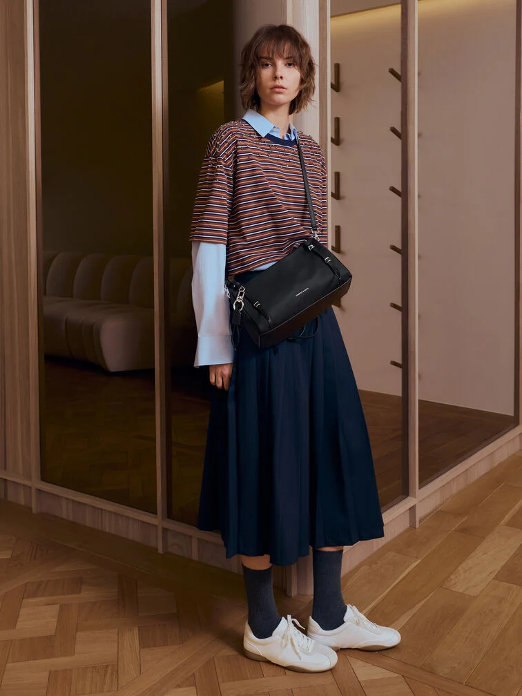 A black crossbody bag offers maximum versatility and is suitable for a wide range of settings.