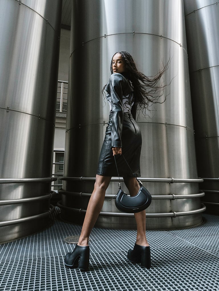 Women’s Petra curved shoulder bag and Pixie platform mules, as seen on Tade – CHARLES & KEITH