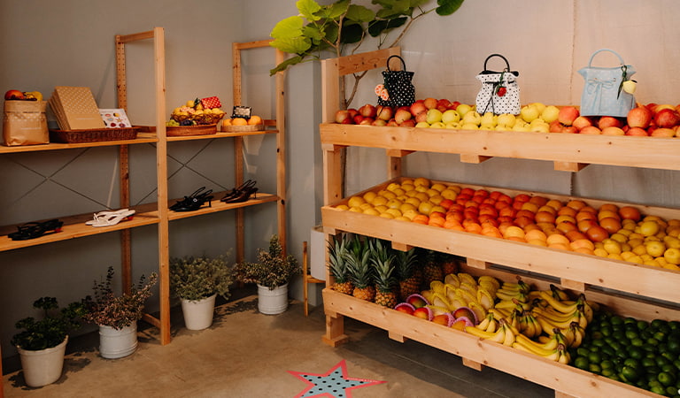 An aesthetic shot of CHARLES & KEITH Kraft paper bags and stickers