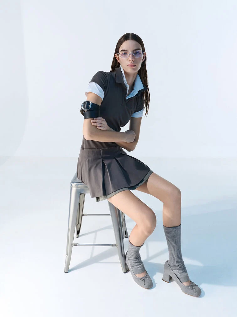  Grey felt Mary Jane pumps with thick furry straps give the classic shoe style a fun sporty vibe. 