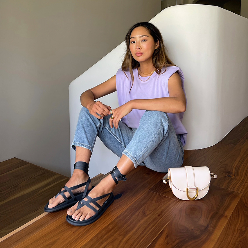 Aimee Song with our Gabine saddle bag in pink and grosgrain tie-around thong sandles in blue – CHARLES & KEITH