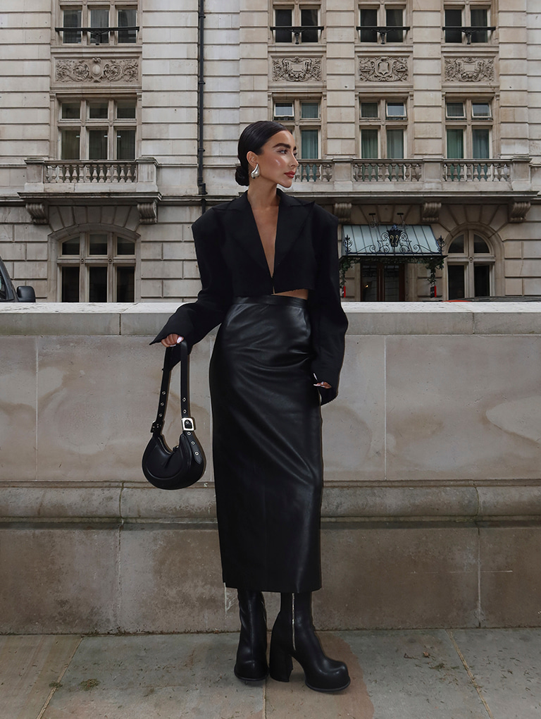 Women’s Petra curved shoulder bag and Pixie platform ankle boots in black, as seen on Izi Angus – CHARLES & KEITH