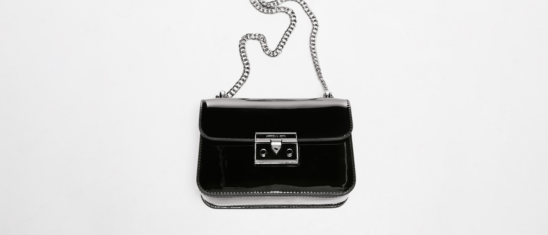 Women’s Alia chain-strap patent crossbody bag in black - CHARLES & KEITH