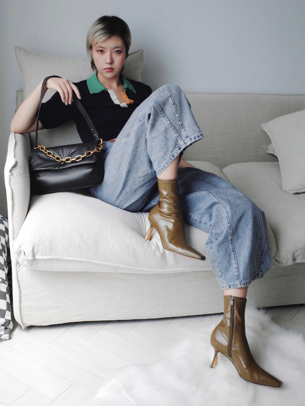 Women’s Zadie padded shoulder bag in black and sculptural ankle boots in olive, as seen on Cheri Nara - CHARLES & KEITH