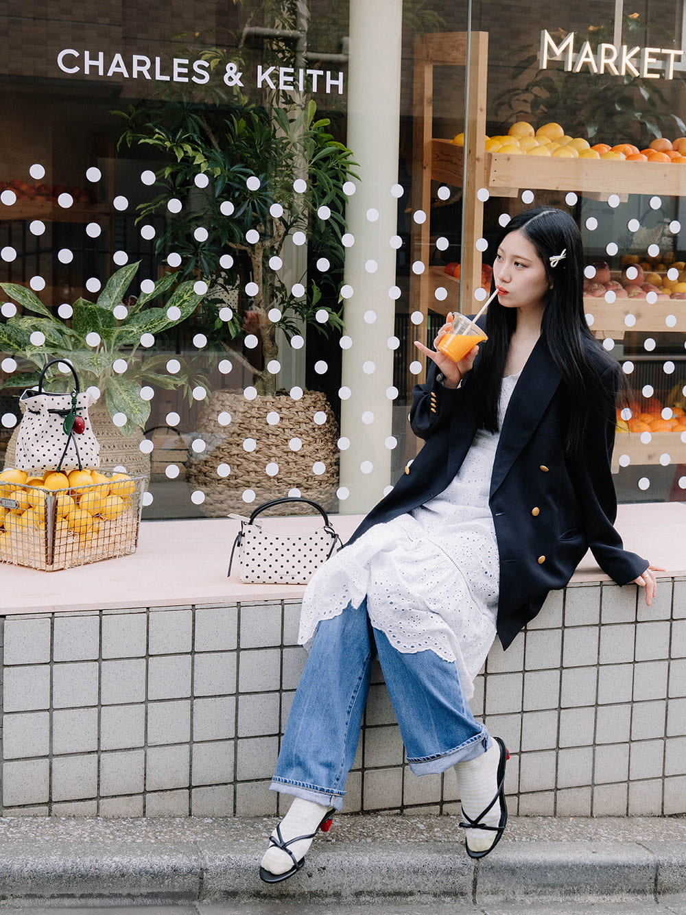Hazel bow polka-dot top handle bag in cream and Sonali bow strawberry-heel mules in black - CHARLES & KEITH