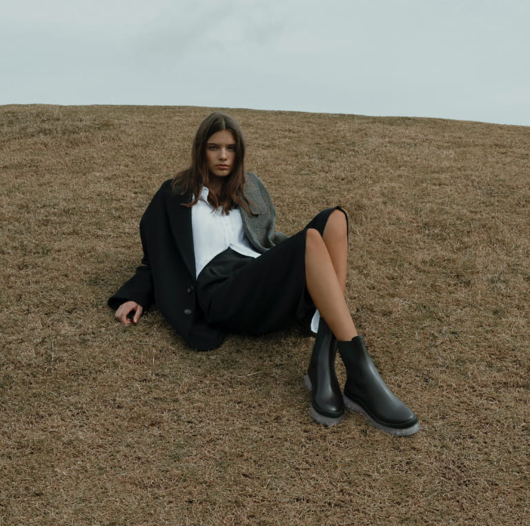Women’s clear sole Chelsea boots in black (front view) - CHARLES & KEITH