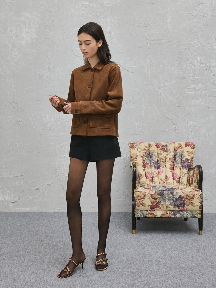Leopard-print bow heeled sandals styled with a suede jacket, mini skirt and sheer tights.