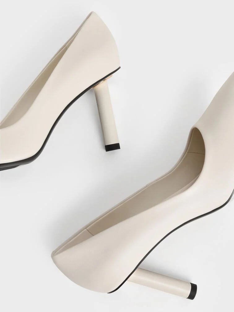 With their visually pleasing symmetry, cylindrical heels have a clean and contemporary aesthetic that is perfect for polished settings. 