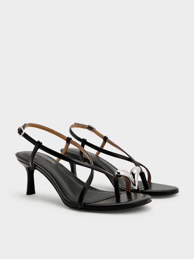  Mid-height heeled sandals with secure crossover straps and toe-ring details are a stylish and comfortable option for all-day wear. 