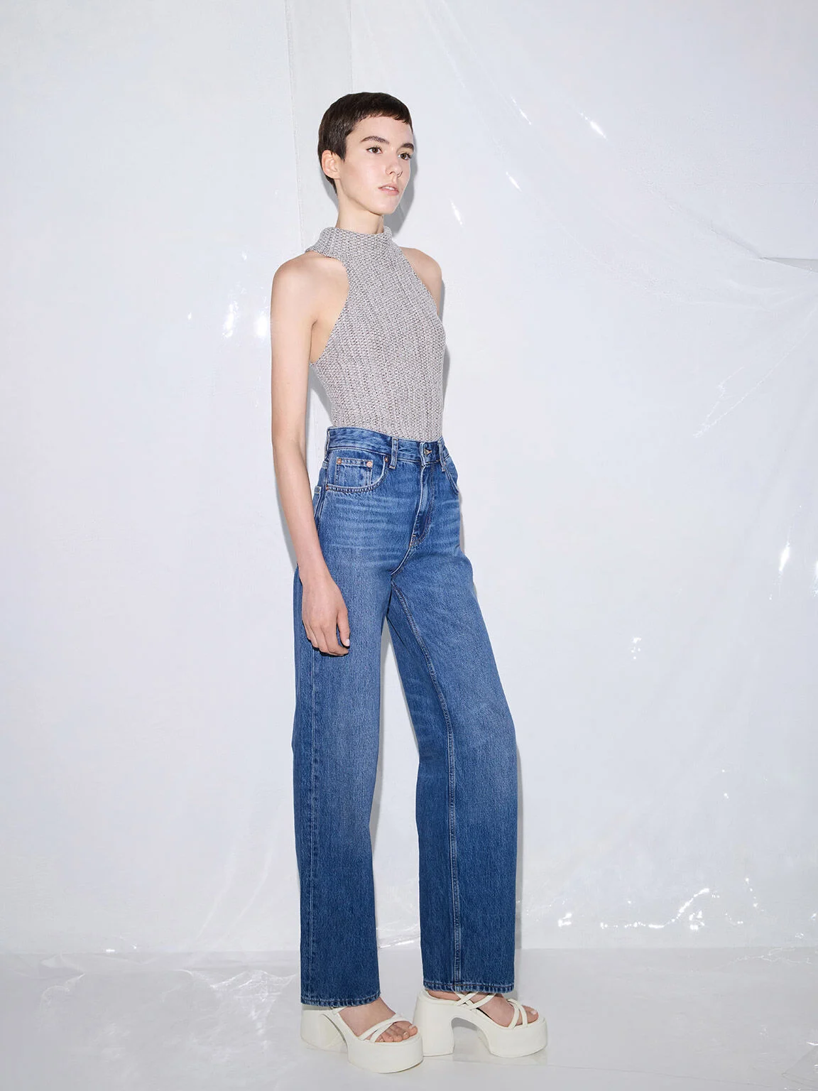 Straight-leg jeans styled with block-heel sandals for an effortlessly elevated look.