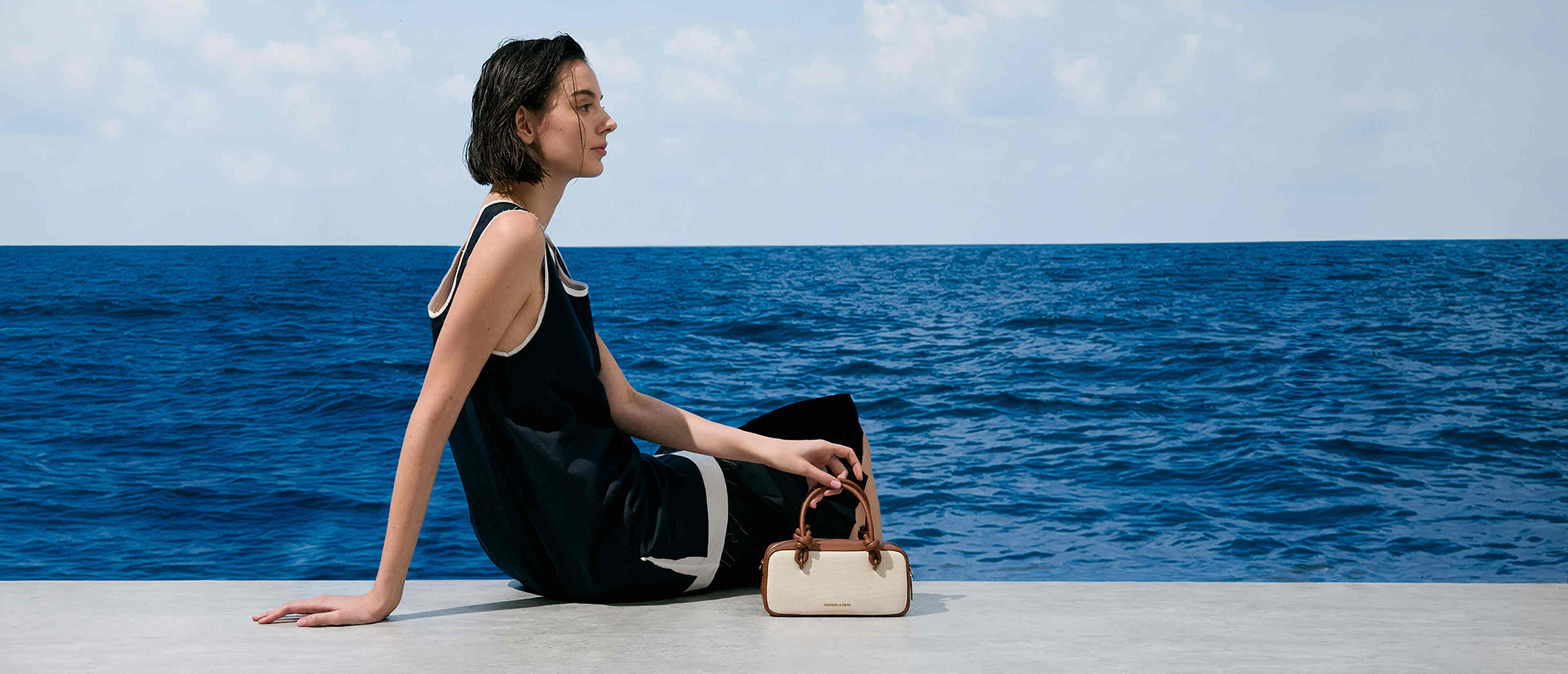 Women’s Sammie canvas knotted-handle elongated bag in taupe canvas - CHARLES & KEITH