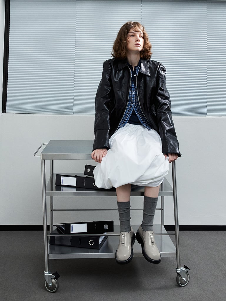 Women’s Nina leather zip-up loafers in grey (on model) – CHARLES & KEITH