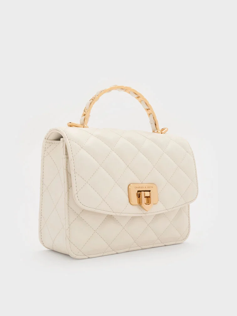 A white quilted bag that will go with almost any winter white outfit.
